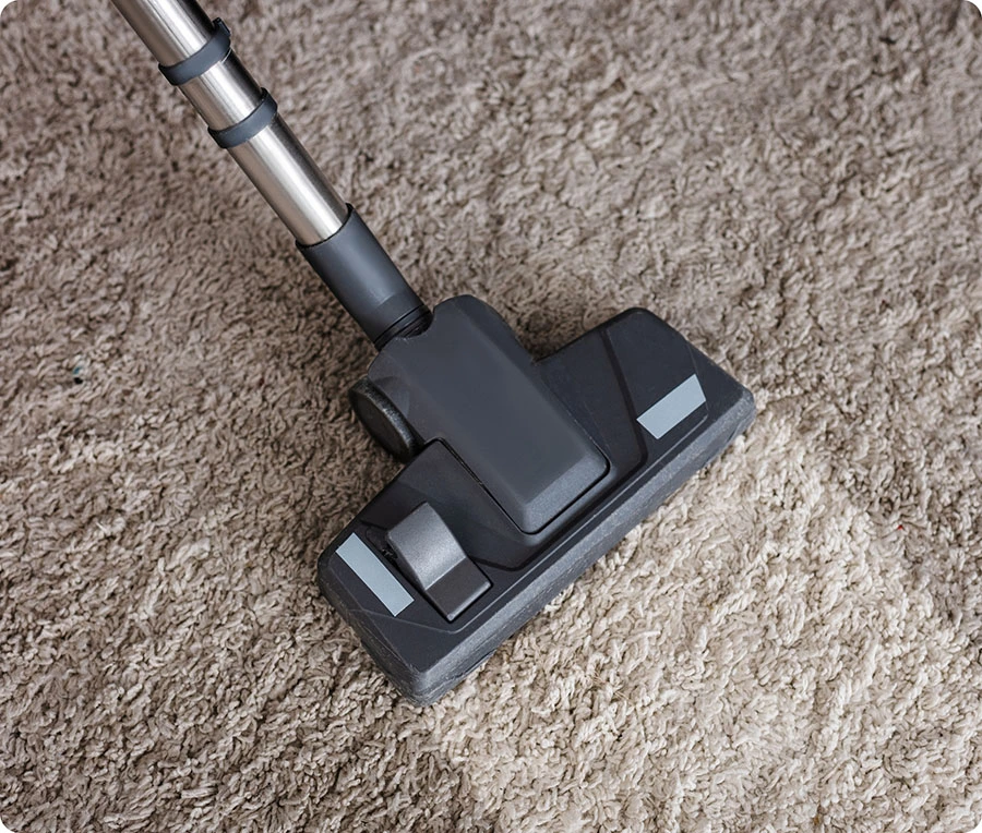Cleaning carpet at home using a vacuum cleaner and carpet cleaner machine