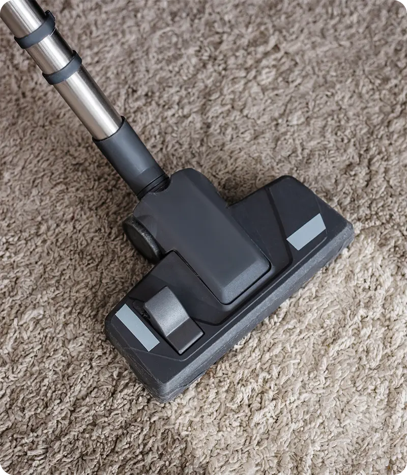 Cleaning carpet at home using a vacuum cleaner and carpet cleaner machine